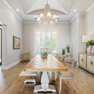 Immense dining room with natural lighting and custom chandalier.