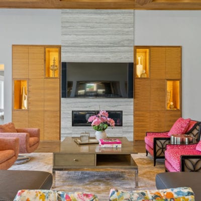 Sleek architecture flanking this fireplace in the massive living area.