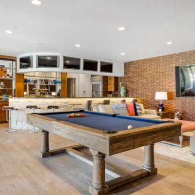 Private sports bar in the walk-out basement of this home featuring 6 TVs so you never miss a minute of the big game!