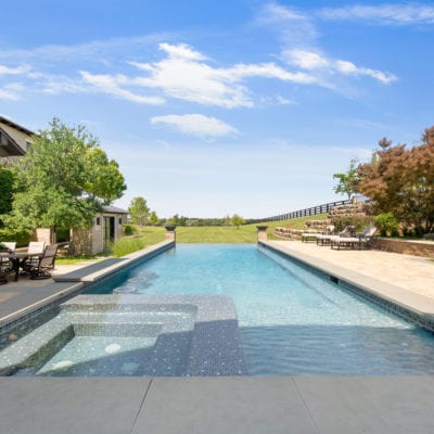 Infinity pool with spa and views for days.